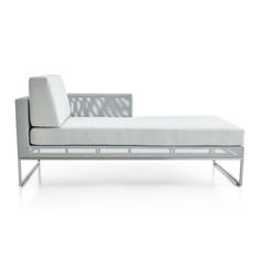 a white couch sitting on top of a metal frame