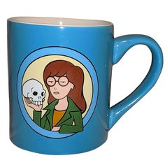 a blue coffee mug with a woman holding a skull in it's right hand