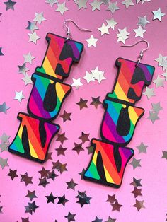 Life is too short to be beige, so spread a bit of fun wherever you go in these bright and bold statement earrings! Pump up the fun factor with these rainbow stripe mega earrings - literallyyy injecting some extra fun into your lewk - good times and good vibes guaranteed!  Made from laser cut birch ply wood, these are super light weight and comfortable to wear. Sterling silver hooks.  Measurements: 103mm height x 36mm width Please note the grain and texture of the wood may vary slightly from piece to piece. Fun Rainbow Earrings For Summer, Trendy Rainbow Earrings For Summer, Trendy Rainbow Jewelry For Pride, Fun Rainbow Drop Earrings, Trendy Rainbow Party Earrings, Trendy Rainbow Earrings For Party, Fun Rainbow Earrings, Playful Rainbow Earrings, Ply Wood