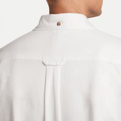 Style No. FN3125-121 Color: Summit White/Summit White A classic Oxford made from soft, breathable chambray fabric, this button-down shirt from our Nike Life Collection gives you a high-quality piece to pair up with your favourite jeans, shorts or chinos. The full-length placket and button-down collar let you keep your look polished. Plus, it's designed to feel roomy around the shoulders and body for easy comfort and layering. Nike Life Men's Long-Sleeve Oxford Button-Down Shirt. White Button-up Dress Shirt With Pockets, Solid Color Collared Shirt With Functional Buttons, Classic Shirt With Button Cuffs And Casual Collar, Casual Collared Dress Shirt With Button Cuffs, White Casual Dress Shirt With Button Closure, Classic Everyday Shirt With Buttons, Nike Classic Fitted Tops, Classic Fitted Nike Tops, Classic Shirt With Snap Buttons For Everyday