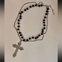 Beautiful Statement Piece, Gothic Cross Pendant On A Double Layered Black Beaded Choker Necklace. *Beaded Chain Length: 35cm + 5cm Extension Chain. *Silver Tone Chain Length: 40cm+5cm Extension Chain. *Cross Size: 5.5cm X 3.7cm *Material: Zinc Alloy. *Brand New. * Ready To Ship Next Day * If You Are Interested In More Than One Item From My Store Pleased Message Me To Make A Bundle For You With Combined Shipping. #Bigcross #Crystaljewelry #Rosarynecklace #Crossnecklace #Grungenecklace Tags: Gothi Gothic Silver Beaded Necklaces With Black Beads, Black Metal Beaded Necklace With Silver Beads, Black Beaded Necklace With Silver Beads, Black Beaded Cross Necklace, Grunge Beaded Necklace, Beaded Cross Necklace, Grunge Necklace, Layered Beaded Necklaces, Gothic Cross