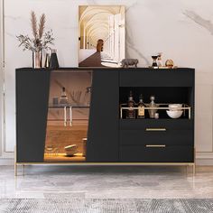 a black and gold sideboard with glass doors in a living room or dining room