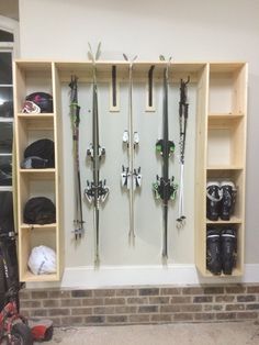 there are many skis and snowboards on the wall