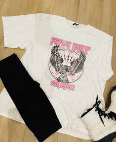 Mineral washed, distressed, boyfriend graphic tee. The Freebird design with hot pink accents is so girly and fun! These run big! I wear a small/medium in this and it’s plenty big! 100% cotton Pink Distressed Casual T-shirt, Casual Pink Distressed T-shirt, Pink Distressed Graphic Tee, Pink Distressed T-shirt For Summer, Pink Distressed Summer T-shirt, Trendy Ripped Cotton T-shirt, Trendy Ripped T-shirt For Summer, Spring Trendy Distressed T-shirt, Trendy Distressed Pink Top