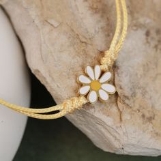 MantraBand Daisy Thread Bracelet in Yellow Yellow Resizable Jewelry For Friendship, Casual Gold Friendship Bracelets For Spring, Yellow Adjustable Length Jewelry For Beach, Casual Hypoallergenic Yellow Jewelry, Casual Yellow Hypoallergenic Jewelry, Adjustable Yellow Charm Bracelet As A Gift, Adjustable Yellow Charm Bracelet Gift, Dainty Adjustable Yellow Jewelry, Adjustable Yellow Charm Bracelet For Gift