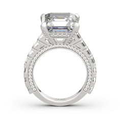 She'll know just how much she means to you with this glittering engagement ring on her finger.This design showcases a brilliant asscher cut stone sparkles at the center, while additional stones adorn the shank for extra shimmer. "I love you" comes in many forms. Say it your way with this beautiful engagement ring.Carat Weight: 14.15 ctStone Size: 12*12 mmStone Type: Jeulia® StoneNumber of Stones: 1 Stone Color: Diamond WhiteStone Shape: AsscherCarat Weight: 4.928 ctStone Size: 1,1.3,3*3 mmStone Jeulia Jewelry, Asscher Cut, Beautiful Engagement Rings, Classic Ring, Showcase Design, Ring Silver, Stone Settings, Quality Jewelry, Sterling Silver Ring