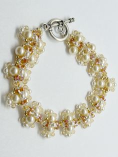 Gorgeous- that's what I hear all the time when I wear this bracelet! I get so many compliments that I decided to weave one for you! It was created using shiny light cream ivory pearls. The accent beads are  gold and ivory. It is completed with a barrel hook clasp. It comes gift boxed.  This bracelet is ready to ship, however, if you would like for me to create the bracelet in another size or other colors, please contact me and I can create one to meet your specifications. Beaded Pearl White Round Bracelet, Pearl White Beaded Round Pearl Bracelet, Elegant Pearl White Beaded Bracelets For Jewelry Making, Pearl White Beaded Bracelets With Pearl Drop, Cream Beaded Bracelets For Wedding With Round Beads, Cream Beaded Bracelets With Round Beads For Wedding, Handmade Elegant Pearl White Beaded Bracelets, Pearl White Beaded Bracelet Gift, Pearl White Beaded Bracelet For Gift