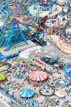 an aerial view of a carnival with many rides