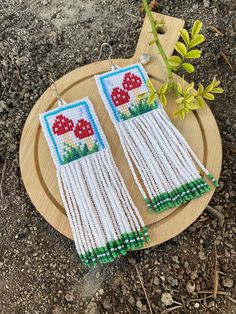 Red mushroom beaded fringe earrings seed bead earrings dangle boho earrings chandelier earrings native beaded earrings colorful beaded ♥𝑇ℎ𝑒 𝑝𝑎𝑡𝑡𝑒𝑟𝑛 𝑜𝑓 𝑡ℎ𝑖𝑠 𝑒𝑎𝑟𝑟𝑖𝑛𝑔 𝑖𝑠 𝑐𝑟𝑒𝑎𝑡𝑒𝑑 𝑏𝑦 𝐾𝑎𝑍𝑒𝐵𝑒𝑎𝑑𝐽𝑒𝑤𝑒𝑙𝑟𝑦 ♥𝑀𝑎𝑑𝑒 𝑢𝑠𝑖𝑛𝑔 𝑓𝑟𝑒𝑒ℎ𝑎𝑛𝑑 𝑏𝑒𝑎𝑑𝑖𝑛𝑔 𝑤𝑜𝑣𝑒𝑛 𝑡𝑒𝑐ℎ𝑛𝑖𝑞𝑢𝑒𝑠 𝑤𝑖𝑡ℎ 𝑠𝑡𝑟𝑜𝑛𝑔 𝑠𝑦𝑛𝑡ℎ𝑒𝑡𝑖𝑐 𝑡ℎ𝑟𝑒𝑎𝑑. ♥𝑇ℎ𝑒 𝑠𝑖𝑧𝑒 𝑜𝑓 𝑡ℎ𝑒 𝑠𝑒𝑒𝑑 𝑏𝑒𝑎𝑑𝑠 𝑢𝑠𝑒𝑑 𝑖𝑠 2 𝑚𝑖𝑙𝑙𝑖𝑚𝑒𝑡𝑒𝑟𝑠 𝑎𝑛𝑑 𝑏𝑒𝑎𝑑𝑠 𝑎𝑟𝑒 ℎ𝑖𝑔ℎ 𝑞𝑢𝑎𝑙𝑖𝑓𝑖𝑒𝑑. ♥𝐴𝑙𝑙 𝑡ℎ𝑒 ℎ𝑜𝑜𝑘𝑠 𝑢𝑠𝑒𝑑 𝑖𝑛 𝑜𝑢𝑟 𝑗𝑒𝑤𝑒𝑙𝑟𝑦 𝑎𝑟𝑒 24 𝑘 𝑔𝑜𝑙𝑑 𝑝𝑙𝑎𝑡𝑒𝑑 𝑎𝑛𝑑 ℎ𝑦𝑝𝑜𝑎𝑙𝑙𝑒𝑟𝑔𝑒𝑛𝑖𝑐. ♥𝑇ℎ𝑒𝑠𝑒 𝑎𝑟𝑒 𝑣𝑒𝑟𝑦 𝑙𝑖𝑔ℎ𝑡 𝑒𝑎𝑟𝑟𝑖𝑛𝑔𝑠 𝑡ℎ𝑎𝑡 𝑦𝑜𝑢 𝑐𝑎𝑛 𝑤𝑒𝑎𝑟 𝑎𝑙𝑙 𝑑𝑎𝑦 𝑤𝑖𝑡ℎ𝑜𝑢𝑡 ℎ𝑢𝑟𝑡𝑖𝑛𝑔 𝑦𝑜𝑢𝑟 𝑒𝑎𝑟! The only ac Native Beaded Earrings, Mushroom Earrings, Beaded Fringe Earrings, Red Mushroom, Earrings Chandelier, Earrings Colorful, Light Earrings, Beaded Fringe, Seed Bead Earrings