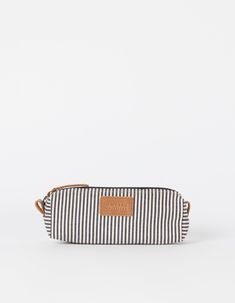 When you sit at your desk, kitchen table or maybe a local cafe, you probably don’t want to ruffle through your bag to find your long lost pens. We at O My Bag hear you! Our Signature Pencil Case is a sleek zip pouch for pens, pencils, markers and small personal items. Our striped cotton and camel leather details make this case a casual and fun take on a classic pencil case. Made from certified cotton, the Signature Pencil Case opens with a zip and lets you organize your space exactly the way you Casual Pencil Case With Pen Holders, Casual Travel Pencil Case With Pen Slots, Casual Pencil Case For Daily Use, Casual Pencil-shaped Pencil Case For Daily Use, Casual Pencil Case With Pen Slots For Everyday, Casual Rectangular Travel Pencil Case, Casual Pencil Case With Pen Slots, Casual Rectangular Pencil Case For Everyday Use, Casual Rectangular Pencil Case