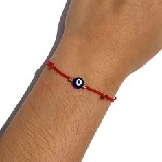 "🧿 SUMMER SALE 2021 🧿 You are looking at the trendy Red String Navy Blue Glass Evil Eye Adjustable Bracelet. Video Tutorial: https://youtu.be/LFSR8Q2q2x4 The History of the Evil Eye: The evil eye is one of the strongest and most powerful ancient symbols in the world. It dates back as early as 5000 BC in Mesopotamia and has roots in Christian, Jewish, Muslim, Buddhist, and Hindu cultures. The evil eye's roots run deep, worn daily in antiquity and today, and for good reason. The Power and Symbol Adjustable Red Charm Bracelet, Adjustable Red Round Charm Bracelet, Adjustable Round Red Charm Bracelet, Adjustable Red Evil Eye Friendship Bracelets, Adjustable Red Evil Eye Bracelet For Friendship, Handmade Red Evil Eye Bracelet, Red Evil Eye Friendship Bracelet, Red Evil Eye Jewelry, Adjustable Red Bracelets With Evil Eye