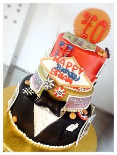 a birthday cake is decorated with an image of a man's suit and hat