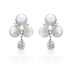 Exquisitely crafted, these earrings perfectly capture the romance of your special day. The design boasts a single pear-like cubic zirconia gemstone suspended elegantly from a luscious pearl flower. Crafted with utmost care, these earrings measure 1.5 inches long and are made from a durable alloy, free of lead, nickel, and cadmium. Matching bracelet here. Pearl Statement Earrings, Matching Bracelet, Pearl Flower, Matching Bracelets, Statement Earrings, Special Day, Pear, Cubic Zirconia, Vintage Jewelry