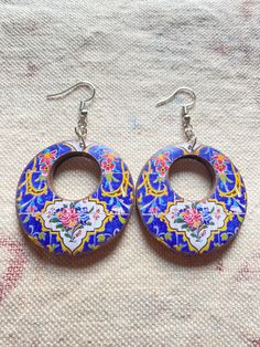 Handmade Persian earrings, It is popular with women of all ages and therefore makes a great gift for mothers, daughters, wives, or girlfriends. Especially for a Persian girl or the one who like history and traditional architecture. the motives inspired from Persian architecture. earring diameter 4 cm. earring height 7 cm. The creation of Persian tiles began about 1200 A.D. and Persian tiles decorating reached it's zenith in the 18th and 19th centuries. Simply put, Persia has the most beautiful t Pomegranate Jewelry, Persian Architecture, Ceramic Accessory, Glazed Brick, Persian Motifs, Wooden Stars, Ceramic Pendant, Tile Work, Antique Design