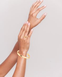 The Loretta Cuff, plated in exquisite 14k gold or silver finish, offers a minimalistic charm. Its versatility makes it a perfect complement to other bracelets. We offer resizing options to ensure the best fit. A timeless classic for your collection. View this post on Instagram A post shared by 𝔹𝕠𝕦𝕟𝕜𝕚𝕥 𝕁𝕖𝕨𝕖𝕝𝕣𝕪 (@bounkitnyc) Timeless Gold-plated Jewelry With Bracelet Strap, Timeless Gold-plated Bracelet Strap Jewelry, Elegant Bangle With Polished Finish For Everyday Luxury, Elegant Polished Bangle For Everyday Luxury, Chic Yellow Gold Open Band Jewelry, Gold Minimalist Bracelet For Formal Occasions, Formal Gold Minimalist Bracelet, Formal Minimalist Gold Bracelet, Modern 14k Gold Bracelets For Everyday Luxury