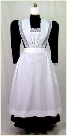 a white dress with black sleeves and collar