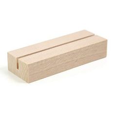 a small wooden block on a white background with clippings to cut out the edges