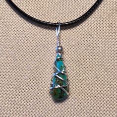 Handcrafted Wire Wrapped Kingman Arizona Turquoise Pendant Necklace. 20” Black Cord With 2” Chain Extension Silver Toned Wire And Accent Bead Interchangeable With Other Chains Or Ribbons You May Have To Wear As A Choker Or Any Length You Prefer. Great Gift Idea Fast Shipper Made In Usa Boho Chic Fashion Delicate Layered Statement Necklace Essential Accessory Nickel-free Turquoise Silver-plated Wire Jewelry, Nickel-free Turquoise Jewelry In Silver-plated Wire, Nickel-free Turquoise Silver-plated Jewelry, Adjustable Silver Turquoise Necklace With Lobster Clasp, Turquoise Wire Wrapped Silver-plated Jewelry, Turquoise Pendant Necklace Wire Wrapped, Turquoise Wire Wrapped Silver Plated Jewelry, Bohemian Silver Plated Wire Necklaces Nickel Free, Adjustable Silver Turquoise Necklace Spiritual Style