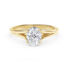 a yellow gold engagement ring with a round diamond in the center, on a white background