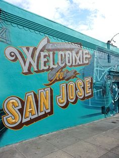 a mural on the side of a building that says welcome to san jose