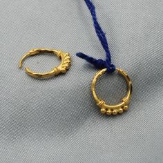 Pure Handmade Beautiful yellow gold Hoop Bali earrings  Gold Purity- 20k yellow Gold Full Length - 1.3 cm approx Full Width - 1.1 cm approx Weight: 0.9 grams approx click to see similar  https://www.etsy.com/in-en/shop/morvijewels?ref=seller-platform-mcnav Gold Small Hoop Jewelry With Matching Earrings, Small Hoop Pierced Cartilage Earrings As Gift, Yellow Gold Brass Huggie Earrings Gift, Gold Hoop Jewelry With Matching Earrings, Gold Dangle Huggie Earrings, Nickel-free Hoop Earrings For Festivals, Gold Dangle Huggie Earrings For Pierced Ears, Nickel-free Hoop Earrings For Festive Occasions, Gold Dainty Pierced Hoop Earrings