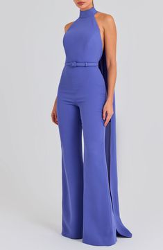 An open back and a halter neck bring flirty appeal to this wide-leg jumpsuit with a drapey detail that flows down the back of this belted jumpsuit. 63 1/2" center front length; 34 1/2" inseam; 26" leg opening (size 8) Hidden back zip; keyhole with button-and-loop closure Halter neck Sleeveless, with cutaway shoulders Removable belt Stretch lining 100% polyester Dry clean or hand wash, dry flat Imported Saint Laurent Jumpsuit, Chic Belted Strapless Jumpsuit For Party, Fitted Belted Strapless Jumpsuit, Sleeveless Belted Jumpsuit For Date Night, Belted Sleeveless Jumpsuits And Rompers For Date Night, Chic Belted Jumpsuits And Rompers For Evening, Belted Strapless Sleeveless Jumpsuit, Belted Strapless Jumpsuit, Elegant Wide Leg Belted Jumpsuits And Rompers