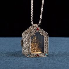 📿 Tibetan Ghau Box Pendant + Solid Brass Buddha Protector Statue  🎁 Great amulet necklace for meditation gift, Buddism practice Spiritual gift, Unique birthday/holiday gift for your family or friends ⚙️ Material: Cupronickle (ghau box) + Brass (Buddha statue) ⚙️ Size: ghau box: 3.4x2.8x4.7cm               buddha statue: varies ⚙️ Weight: ghau box: ~ 30g               buddha statue: ~ 20g 🧘 Encased within the Gau box, this pendant carries a deep significance in Tibetan Buddhism. The Gau box is traditionally used to hold sacred objects, prayers, or relics, serving as a portable shrine for spiritual practice.  🧘 Choose your protector buddha, put it in your ghau box, wear this pendant close to your heart as a daily reminder of your dedication to Buddhism. As you meditate, the Buddha Protec Buddha Necklace Gold, Buddha Pendant Necklace, Prayer Gifts, Brass Pendant Necklace, Spiritual Necklace, Lucky Charm Necklace, Buddha Necklace, Buddhist Prayer, Tibetan Jewelry