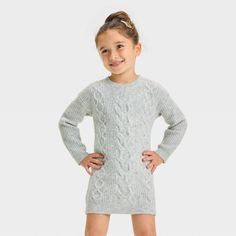 Dress up your toddler in comfort and cute style with this Long-Sleeve Dress from Cat & Jack™. The long-sleeve dress is crafted from knit cotton-blend fabric for comfortable wear. Designed with a round neckline and half-length button-down for ease of wear, this knee-length dress features side pockets for stashing small stuff on the go. Cat & Jack™: Designed for all children so you can trust it's made for yours. Cable Knit Sweater Dress, Cozy Dress, Pointelle Sweater, Ribbed Sweater Dress, Small Stuff, Grey Sweater Dress, Long Sleeve Print Dress, Knit Sweater Dress, Cable Knit Sweater