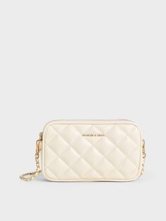 This mini Apfra bag is practical and polished at once. From the beautiful cream hue to the luxuriously plush quilted finish, this is a timeless bag that you can easily dress up or down. While compact in size, it offers ample room to hold all your everyday essentials -- it certainly makes for a great travel companion. Plus, it comes with an adjustable braided strap that is also detachable, so you can use it as a pouch that slots easily into your day bag. Luxury Quilted Cream Shoulder Bag, Chic Cream Quilted Shoulder Bag, Chic Quilted Pouch Bags, White Quilted Evening Bag, Luxury Quilted Pouch Bag, Cream Quilted Shoulder Bag For Everyday Use, Everyday Quilted Cream Shoulder Bag, Everyday Cream Quilted Shoulder Bag, Elegant Quilted Crossbody Bags