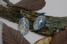 The perfect accessory for aromatherapy lovers, these earrings feature resin leaf pendants with lava stone essential oil charms. Blue Leaf-shaped Jewelry For Gift, Blue Leaf-shaped Jewelry Gift, Nature-inspired Hypoallergenic Leaf Earrings, Nickel Free Leaf Shaped Earrings For Gift, Nickel-free Leaf-shaped Earrings For Gift, Handmade Blue Leaf-shaped Jewelry, Handmade Leaf-shaped Earrings For Gift, Resin Leaf, Lava Stone