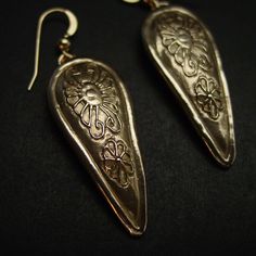 "Hand carved anglo saxon medieval kite shield museum earrings. Earrings design inspired by medieval Britain shields from the 12th century during the reign of the Anglo-Saxon and Vikings. A kite shield is a large, almond-shaped shield rounded at the top and curving down to a point or rounded point at the bottom. The term \"kite shield\" is a reference to the shield's unique shape, and is derived from its supposed similarity to a flying kite. - Hand sculpted and domed - Solid yellow bronze also ca Medieval Style Silver Earrings For Gift, Traditional Bronze Teardrop Earrings, Traditional Engraved Teardrop Earrings, Artisan Teardrop Pierced Earrings, Artisan Engraved Drop Earrings, Medieval Style Handmade Bronze Jewelry, Medieval Handmade Bronze Jewelry, Medieval Style Handmade Earrings For Gift, Handmade Medieval Bronze Jewelry