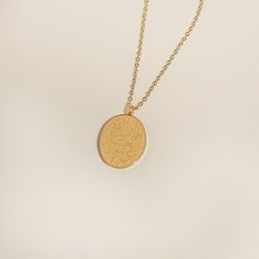 This oval necklace is a stunning piece of jewelry that features a unique and meaningful pendant. It is inscribed with the powerful Quranic verse "Verily, with hardship comes ease" in beautiful calligraphy. This verse, found in Surah Al-Insyirah, reminds us that even in the most challenging of times, there is always hope for a brighter tomorrow. It is a perfect gift for someone going through a challenging period or anyone who wants to display their faith with pride. Whether worn as a statement pi Oval Recycled Gold Necklace Gift, Spiritual Medallion Necklace With Oval Coin Pendant, Oval Medallion Necklace With Coin Pendant For Gift, Spiritual Oval Pendant Medallion Necklace As Gift, Spiritual Medallion Necklace With Oval Pendant As A Gift, Oval Gold Keepsake Necklace, Spiritual Oval Coin Pendant Medallion Necklace, Spiritual Medallion Necklace With Oval Pendant For Gift, Spiritual Oval Engraved Necklaces