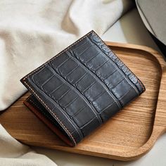 Men's leather Alligator bifold wallet  Thank you for your trust in ordering from us. We appreciate your expressions of appreciation and are especially grateful for the recent wallet order. Hope that our products will bring good luck to you. Thank you for choosing our store to supply your needs. We look forward to sharing your success. 1) Product Description: Dimensions: approx. 110mm x 95mm Color: Dark Grey Material: Outer - Alligator Leather Interior - Alligator Leather Made in Vietnam. 2) Shipping and handling: - We will send through the shipping unit of the shipping enterprises in Vietnam. - After receiving your order, we will take 5 to 7 days to process the product and then ship it to you. - It will take 10-20 days to arrive - Contact us if you need a faster delivery service - Orders p Leather Bifold Card Holder With Crocodile Pattern, Bifold Wallet With Crocodile Pattern For Gift, Bifold Wallet With Crocodile Pattern As Gift, Crocodile Pattern Bifold Wallet As A Gift, Luxury Brown Trifold Wallet As Gift, Luxury Brown Trifold Wallet Gift, Gifts For Him Birthday, Birthday Gifts For Men, Engraved Wallet