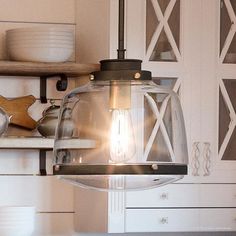 a light hanging from the ceiling in a kitchen