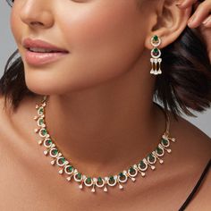 Description: This stunning necklace from our CZ collection showcases a beautiful mix of white and green CZ stones in a sophisticated design. Finished with gold plated- base, it adds a polished touch to any outfit. Whether as a gift or for special occasions, this necklace blends timeless elegance with modern style. Details & Specification: Materials used: Brass Alloy with Gold & White Gold Plating Weight - Necklace- 23 gm, Earrings- 6 gm Length - Necklace- 10 cm, Earrings- 3.5 cm Make it custom: Elegant Green Diamond Necklace, Elegant Green Diamond Necklace With Jewels, Elegant Emerald Kundan Necklace For Gift, Dazzling Green Diamond Necklace For Gift, Dazzling Green Diamond Necklace Gift, Elegant Green Kundan Necklace As Gift, Green Elegant Design Necklace For Gift, Elegant Green Kundan Necklace Gift, Elegant Green Kundan Necklace For Formal Occasions