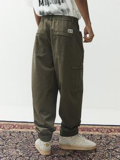 This is a casual and comfortable balloon pants that is made out of sturdy cotton 100% fabric. With soft touch of the fabric, elastic waistband, and hidden pocket, it can be easily styled for your daily outfit.- Washed cotton twill fabric for soft touch- Elastic waistband- Hidden pocket detail Khaki Cotton Cargo Pants With Patch Pockets, Cotton Cargo Style Harem Pants For Streetwear, Cotton Cargo-style Harem Pants For Streetwear, Casual Khaki Cargo Pants With Patch Pockets, Baggy Tapered Leg Cargo Pants In Cotton, Baggy Cargo Style Cotton Pants, Khaki Cotton Cargo Bottoms, Relaxed Fit Cargo Parachute Pants Ankle-length, Baggy Cotton Straight Cargo Pants