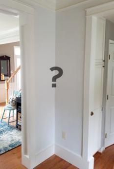 an open door with a question mark on it in the middle of a living room