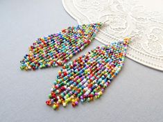 Multicolored fringe earrings Tassel earrings Long Colorful beaded earrings American Indian style jew Rainbow Beaded Fringe Earrings For Gift, Multicolor Fringe Chandelier Earrings For Gift, Multicolor Beaded Tassel Earrings As Gift, Multicolor Beaded Tassel Earrings For Party, Colorful Dangle Tassel Earrings Gift, Multicolor Tassel Dangle Earrings With Colorful Beads, Multicolor Tassel Earrings With Dangling Beads, Multicolor Tassel Earrings With Round Beads, Multicolor Beaded Tassel Dangle Earrings