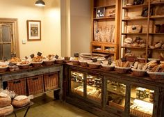 a bakery filled with lots of bread and pastries