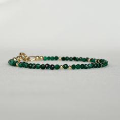 "Discover my minimalist and exquisitely natural emerald green malachite bracelet, elegantly made with 14k gold-filled or sterling silver accents, clasp and findings. This versatile gemstone beaded bracelet is perfect for layering or wearing on its own, achieving a minimalist aesthetic. A timeless jewelry piece that doubles as an ideal gift choice for engagements, weddings, birthdays, or anniversaries, suitable for moms, friends, girlfriends, teachers, or self-indulgence. DETAILS * Transformation Minimalist 14k Gold Filled Dangle Jewelry, Dainty 14k Gold Jewelry With Natural Stones, Everyday 14k Gold Filled Bracelet, Adjustable Gold Gemstone Jewelry, Spiritual Round Beads Jewelry For Gift, Spiritual Round Beads Jewelry Gift, Spiritual 14k Gold Gemstone Jewelry, Faceted 14k Gold Round Jewelry, Spiritual Yellow Gold Jewelry With Gemstones