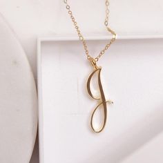 J Initial Necklace - Cursive "J" initial gold pendant necklace - Monogram necklace for women - Personalized gold Initial necklace for her Dainty "J" initial. Perfect every day necklace. Lovely gift for your self, sister, bridesmaids, new mom. Pendant: Base metal is brass and 14K gold plated. Chain is 18 inches, 14 gold filled. Note: model shots might show a different initial, only to illustrate overall look and length of the chain. This listing is for the "J" initial. J Pendant Necklace, J Necklace Initial, Alphabet Necklace Initials, J Initial Necklace, Cursive J, Punjab Culture, Opals Jewelry, Planned Outfits, J Letter