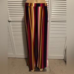 This Is A Great Pair Of Pull On Wide Leg Pants With White, Pink, Mustard, Maroon And Navy Stripes Throughout They Are 95% Polyester, 5% Spandex These Cute Pants Are A Size Medium. Lying Flat Unstretched They Measure 14” Across The Waist, Have An 10” Rise And A 31” Inseam These Are Cool, Comfortable And Come Brand New With The Tags Chic Stretch Multicolor Pants, Stretch Multicolor Pants For Day Out, Chic Fitted Multicolor Wide Leg Pants, Chic Multicolor Stretch Pants, Stretch Multicolor Bottoms For Day Out, Multicolor Stretch Wide Leg Pants For Spring, Fitted Multicolor Bottoms For Day Out, Fitted Multicolor Pants For Day Out, Striped Wide Leg Pants