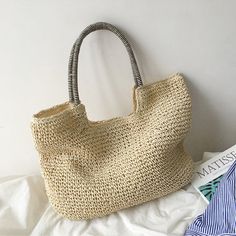 Casual Handheld Straw Bag Made Of Jute, Casual Jute Straw Handheld Bag, Casual Handheld Jute Straw Bag, Casual Woven Handheld Straw Bag, Casual Handheld Woven Straw Bag, Casual Braided Straw Shoulder Bag, Casual Handheld Jute Crochet Bag, Casual Handheld Crochet Jute Bag, Casual Rectangular Braided Crochet Bag