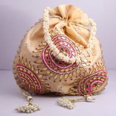 Wholesale Joblot Pack Of 25 Golden Gota Patti Work Hand Embroidered Indian Potli  Women Handbag Wedding Give AwaysMaterial:Silk, Golden Lace, Thread, Golden Metallic WireColor: GoldenPackage Contents: 25Size: 10" x 8"Designed with the heart, this beautiful Potli or batawa bag are eye catchy and made of premium material.Key Features:Embroidery art work. (zardosi work).This potli is good match with both Indian and western outfits and are superb for wedding and festive parties.This would be best co Gold Potli Bag With Gota Work For Reception, Gold Embroidered Bag For Reception, Traditional Bags With Gold Embroidery For Reception, Gold Bag With Gold Embroidery For Reception, Gold Bags With Gold Embroidery For Reception, Festive Beige Bag With Pearl Embroidery, Festive Beige Bags With Pearl Embroidery, Gold Embroidered Potli Bag For Receptions And Festivals, Pink Zari Work Bag For Reception