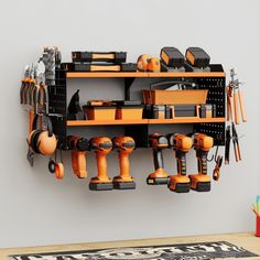 a wall mounted tool rack filled with tools