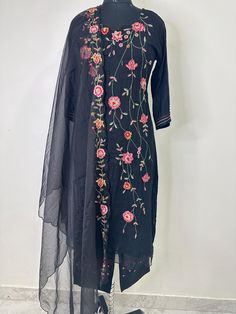 Salwar Kameez Set/Dresses For Women/Indian Wedding Dress/Pakistani Suit/ Kurta Palazzo Set / Kurtis for Women/ Gift for Women / Anarkali Style Kurta Set Product Details Black embroidered Kurta with Trousers with dupatta Kurta design:  * Floral embroidered * A-line shape * Regular style Round neck, three-quarter regular sleeves . Thread work detail * Calf length length with scalloped hem * Pure cotton fabric Trousers design:  * Embroidered Trousers * Elasticated waistband * Slip-on closure Materi Semi-stitched Bollywood Sets With Floral Embroidery, Eid Floral Embroidery Georgette Salwar Kameez, Eid Salwar Kameez With Floral Embroidery In Georgette, Eid Floral Embroidered Georgette Salwar Kameez, Eid Salwar Kameez In Georgette With Floral Embroidery, Floral Embroidered Georgette Churidar For Eid, Traditional Unstitched Suit With Floral Embroidery For Eid, Anarkali Churidar With Floral Embroidery For Transitional Season, Bollywood Straight Kurta Set With Floral Embroidery