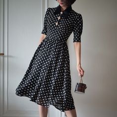 A classic polka dot dress full of elegance. This item has a noble atmosphere from the good old days, with attention to detail in the decoration. The high waist makes it look stylish, and the moderate length gives it a neat and elegant look. 
 
 
 
 
 
 
 
 
 
 Color 
 
 Black collar 
 White collar 
 
 
 Size 
 
 
 XS size 
 
 Length: 105cm 
 Shoulder width: 34.5cm 
 Bust: 80cm 
 Waist: 62cm 
 
 
 S size 
 
 Length: 109cm 
 Shoulder width: 35cm 
 Bust: 84cm 
 Waist: 66cm 
 
 M size 
 
 Length: 10 Elegant A-line Midi Dress For Vintage Fashion, Elegant Vintage Midi Dress For Formal Occasions, Polka Dot Dresses For Vintage Fashion, Elegant Polka Dot Midi Dress For Spring, Elegant Polka Dot Midi Dress For Evening, Vintage Fashion Polka Dot Dresses, Elegant Black Vintage Dress For Summer, Elegant Black Vintage Summer Dress, Polka Dot Midi Dress For Summer Formal