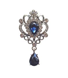 Add a touch of royalty elegance to your outfit with this beautiful blue crystal queen vintage looking brooch pin. The stunning blue teardrop scroll design makes it perfect for any occasion, such as Mother's Day, Christmas, Wedding, Party, Anniversary, Birthday, Christening, Confirmation/Communion, or Valentine's Day. Crafted from high-quality steel with rhodium-plating, this brooch pin is 2.32 inches long and 1.25 inches wide, featuring a gorgeous blue crystal teardrop and clear crystal stones. Its Victorian theme and handmade details make it unique and exquisite. Perfect for any jewelry and fashion enthusiasts, this brooch pin is a great addition to your collection. Christmas Wedding Party, Scroll Design, Clear Crystals, Blue Crystals, Clear Crystal, Beautiful Blue, Crystal Clear, Stones And Crystals, Christening