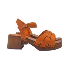 Add a pop of vibrant color to your look with these orange genuine leather sandals Clogs with brown wood effect base Leather upper Soft leather insole Adjustable ankle strap Heel height 6 cm with 3 cm platform Handmade product in Italy The craftsmanship and use of the best materials translate into a very high quality product, perfect for enhancing your elegance on every occasion. BEFORE MAKING THE PURCHASE DO NOT FORGET TO CHECK THE SIZE! --- This handmade item is made and designed entirely by the craftsman Gennaro Duello, founder of Kiara Shoes, Gioie Italiane and My Clogs. Orange Leather Round Toe Clogs, Orange Closed Toe Leather Clogs, Orange Leather Closed Toe Clogs, Orange High Heel Sandals With Buckle Closure, Orange Leather Clogs, Summer Clogs With Wooden Low Heel, Wood Sandals With Leather Sole Open Toe, Orange Leather Open Heel Mules, Orange Leather Platform Wedge Sandals