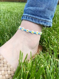 Blue Daisy Anklet Blue seed beads with white seed beads 3mm seed beads Anklet comes as shown* Sunflower Anklet sold separately  Other color options available, please select custom colors and add colors to personalized section.  Made from beads with durable elastic. Average ankle size is 9. Please select ankle size. CARING TIPS FOR YOUR JEWELRY ⭐️Treat and store with care. ⭐️ For longevity, avoid exposing your jewelry to water. ⭐️ Avoid having direct contact with lotions, perfumes, sanitizers as these chemicals may cause discoloration of your jewelry. Spring Anklets With Colorful Beads, Adjustable White Anklets For Spring, Casual Handmade Beaded Bracelets, Colorful Beaded Anklets For Spring Gift, Handmade Adjustable Anklets For Spring, Adjustable Anklets For Spring Gift, Spring Gift Anklets With Colorful Beads, White Round Bead Anklets For Summer, White Round Beads Anklet For Summer